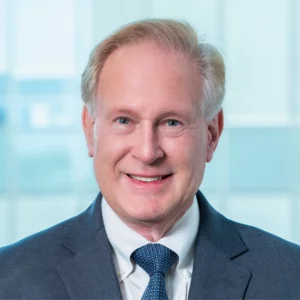 Headshot Robert Lusting Grey Suit Blue Tie