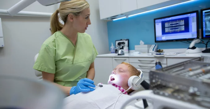 Hygienist with Adolescent Patient