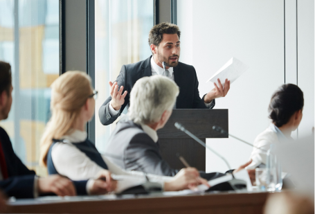 Lawmakers in a conference room debate a bill