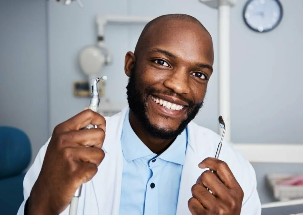 Dental hygienist holding dentistry tools